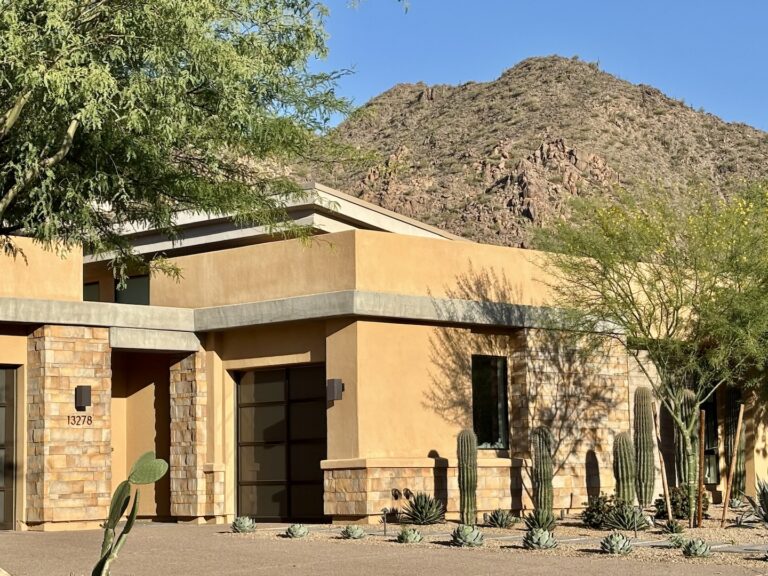 A luxury desert home in the Hidden Hills neighborhood of Scottsdale, Arizona, featuring modern architecture and views of the McDowell Mountains.