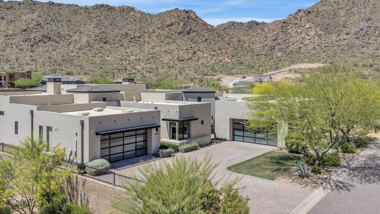 Aerial view of modern luxury home in Scottsdale, Arizona with private pool and patio
